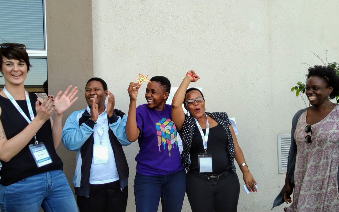 Participants celebrate at the end of an activity at the 2019 TaRL Workshop.