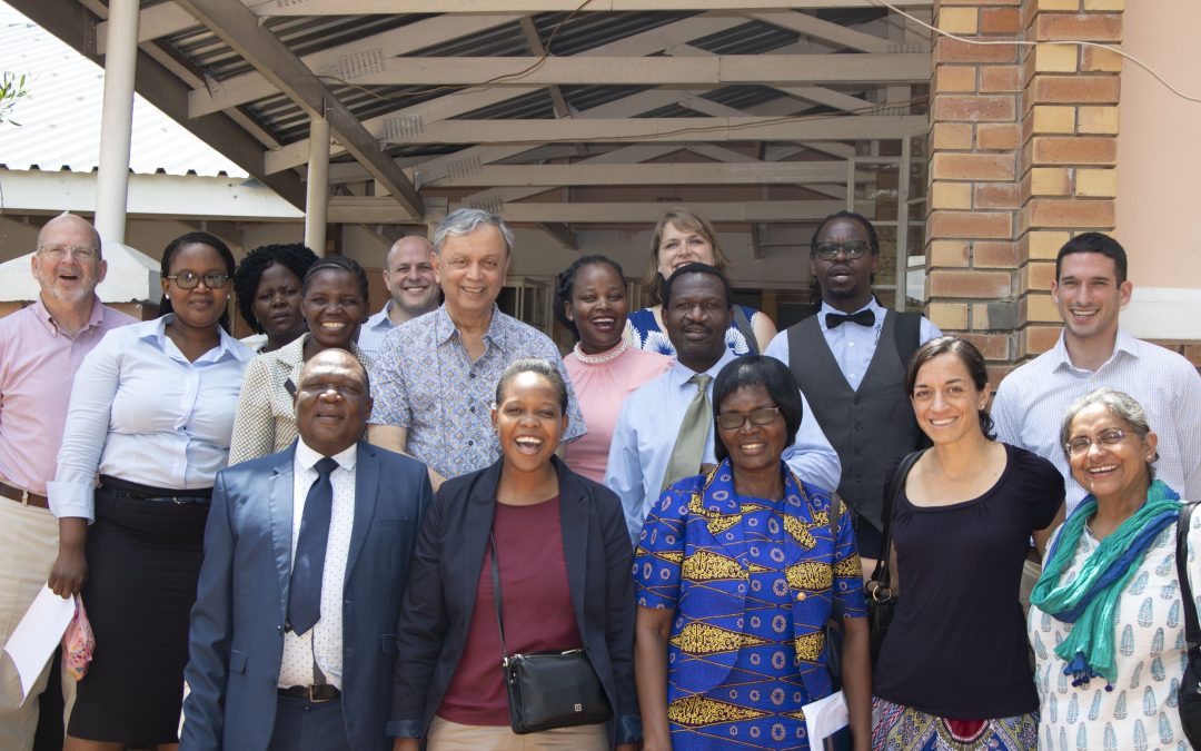 People pose for a group photo (the TaRL board, Young 1ove team, and Botswana school officials).